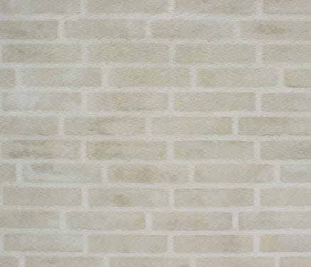 Lys murstensvæg med lysegrå fuger